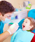 Dentist using Pro Grade Dental Scraper Tool For Teeth Cleaning Stainless Steel Dentist Pick Tartar Remover on child in chair