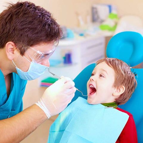 Dentist using Pro Grade Dental Scraper Tool For Teeth Cleaning Stainless Steel Dentist Pick Tartar Remover on child in chair
