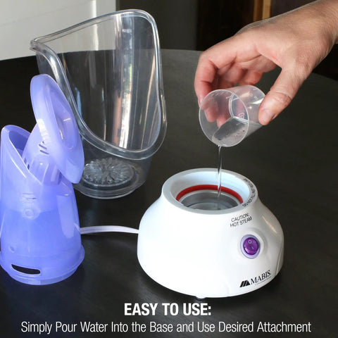 Pouring water into the All In One Face Steamer With Adjustable Facial And Nasal Mask For Sinus Relief Skincare Pore Cleansing Plug In Vaporizer Humidifier 60ml Capacity Travel Ready And Great For Home Spa base unit