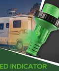Close-up of 15 Amp To 30 Amp RV Adapter Cord With Locking NEMA L5-30R To NEMA 5-15P, LED power indicator, against RV background.