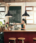 Top Shelf Vintage Industrial Pendant Light Black Metal Farmhouse Ceiling Fixture 11.4 Inch Wide over a coffee bar.