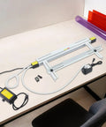 24 Inch 1000W Acrylic Heat Bending Machine With Water Cooling For Plexiglass Plastic on a workspace with various colored acrylic sheets.