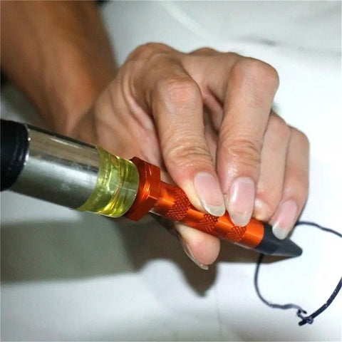 DIY Paintless Dent Repair Kit With 9 Heads Tap Down Pen For Small Dings And Hail Damage being used on flat metal surface.