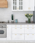 Modern kitchen with white cabinets featuring Gold Brushed Brass Square Cabinet Pulls 2-1/2 Inch Center-to-Center, 4 Inch Overall Length.