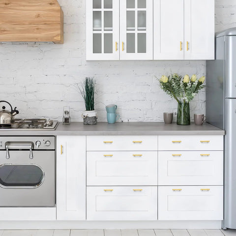Modern kitchen with white cabinets featuring Gold Brushed Brass Square Cabinet Pulls 2-1/2 Inch Center-to-Center, 4 Inch Overall Length.