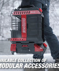 Person carrying BuddyFLEX space heater with modular accessories, outdoors in winter setting