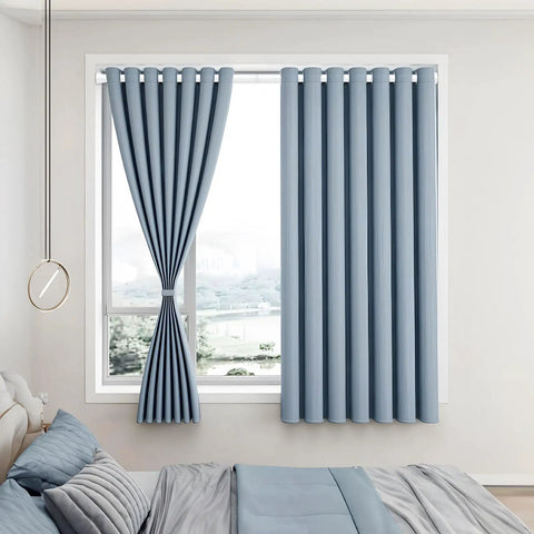 Light blue curtains hanging on a window in a bedroom with a modern, minimal design. Adjustable Shower Curtain Rod Fits 30 To 64 Inches No Drilling Tension Rod With Spring Loaded Design Rustproof And Non Slip For Bathroom Window Doorway Closet Cupboard.