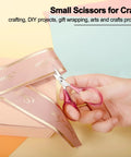 Person using Tiny Travel Scissors 3 Inch TSA Compliant With Sheath Ultra Sharp All Purpose Small Craft Scissors For Detail Work Straight Fine Tips on ribbon