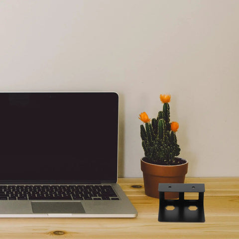Heavy Duty Under Desk Laptop Mount With Scuff Proof Rubber Pads, Smooth Glide Keyboard Shelf And Compact Workstation Organizer That Truly Levels Up Your Home Office Setup next to a laptop and a cactus.