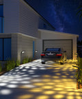 Four Pack Solar Pathway Lights For Outdoor Use No Wiring Required Waterproof Landscape Lighting illuminating driveway with patterns