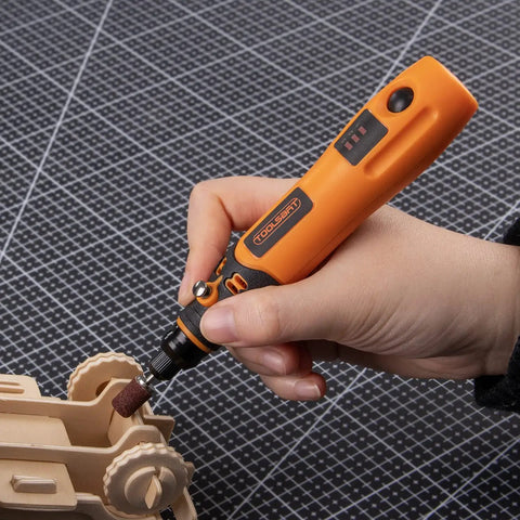 Hand using Mini Cordless Rotary Tool Kit With 3 Speed Settings And 50 Accessories, 3.7V Rechargeable Rotary Tool for crafting