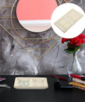 Slick Ceramic Jewelry Tray Featuring A Double Grid Ring Holder And Classy Gold Trim Trinket Dish For Your Nightstand Vibe And Staple Small Daily Organizer displaying rings and earrings on a dark table.