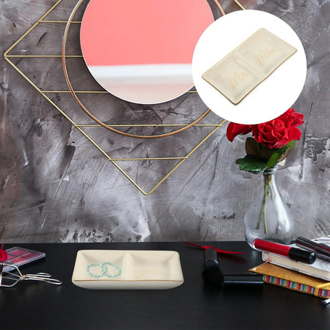 Slick Ceramic Jewelry Tray Featuring A Double Grid Ring Holder And Classy Gold Trim Trinket Dish For Your Nightstand Vibe And Staple Small Daily Organizer displaying rings and earrings on a dark table.