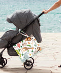 Waterproof Wet Bag For Swimwear And Baby Cloth Diapers Travel attached to a stroller by the beach, animal print design