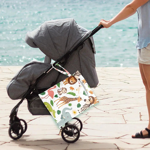 Waterproof Wet Bag For Swimwear And Baby Cloth Diapers Travel attached to a stroller by the beach, animal print design