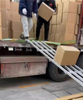 Stainless Steel Frame Unloading Pulley With ABS Plastic Skate Wheels For Flow Rack Unpowered Conveyor Rail in use
