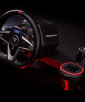 Badass H Pattern Sim Racing Gear Shifter With Seven Plus Reverse Gears For Real Manual Transmission Feel Plug And Play Game Changer For PS5 Xbox PC Steering Wheel Setups That Will Elevate Your Cockpit Rig To Pro Levels Instantly displaying Thrustmaster steering wheel and shifter setup.