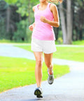 Woman jogging in park wearing Girls Quick Dry Athletic Shorts With Liner For Running, Soccer, And Volleyball, Lightweight Fabric