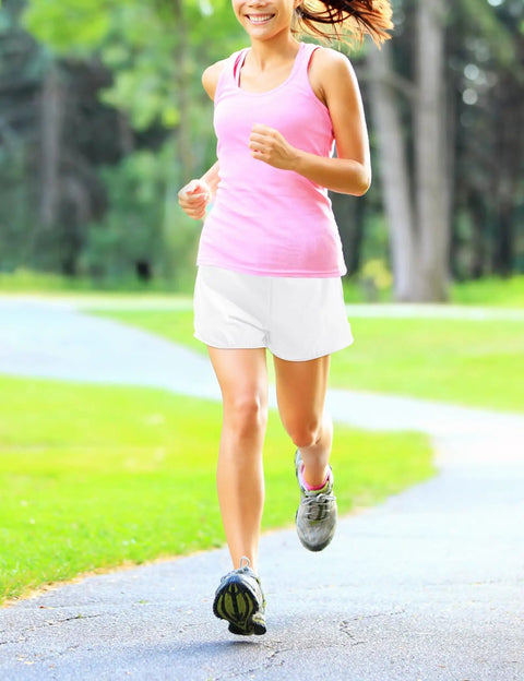 Woman jogging in park wearing Girls Quick Dry Athletic Shorts With Liner For Running, Soccer, And Volleyball, Lightweight Fabric