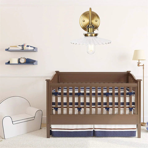 Nordic Ceramic Gold Wall Sconce With On Off Switch above a crib in a nursery with modern decor