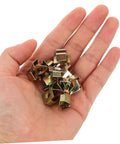 50 Pack Premium Automotive Fastener Clips Golden Iron Captive Nuts held in hand for vehicle shield retention and modifications.