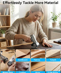 Get Electric Box Cutter At 320Rpm Speed, cutting leather on a table, showcasing ergonomic design and adjustable settings.