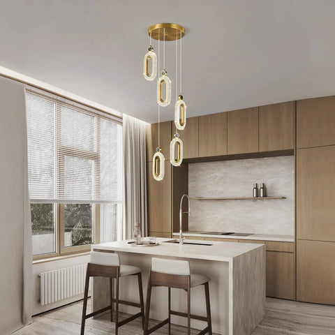 Lit Gold Brushed Modern Pendant Lights For Kitchen Island Three Pack LED Dimmable Mini Pendants For Bedroom Hallway Entryway Home Living Space Lighting Fixture in a modern kitchen setting