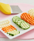 Crinkle cutter with yellow plastic handle and stainless steel wavy blade; includes protective case.