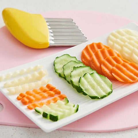 Crinkle cutter with yellow plastic handle and stainless steel wavy blade; includes protective case.