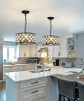 Three Light Modern Crystal Chandelier In Black Metal Farmhouse Pendant Light with adjustable chain in a modern kitchen.