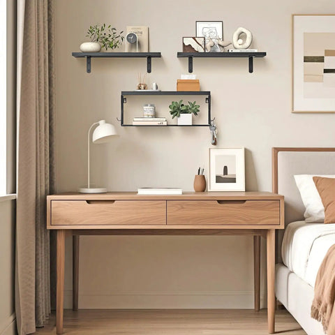 Heavy Duty Floating Bathroom Shelves Wall Mounted Set Of Three With Slick Black Finish For Over Toilet Storage and decorative items on wall.