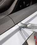 4140 Steel Automotive Pry Tool For Trim Panels And Fasteners removing a car trim panel with ergonomic curved tip.