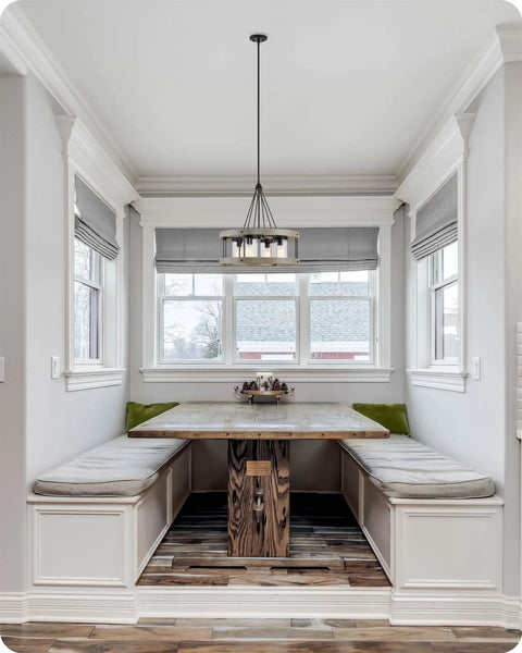 Hayden 25 Inch 4 Light Modern Farmhouse Drum Pendant Light With Cylinder Glass Shades in kitchen nook area.