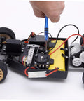 Hand using Rc Car Screw Tool Kit With Compact Storage Box, Gasket And Replacement Fasteners on RC car chassis for maintenance