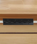 Close-up of Six Piece Heavy Duty Matte Black Piano Hinges 8 Inch Continuous Steel Hardware installed on wood.