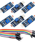 Six Pack 5mm LDR Light Sensor With LM393 Digital DO And Analog AO Output For Arduino Raspberry Pi ESP32 3.3 to 5V Compatible Photoresistor 5516 3 Pin Module shown with colorful jumper wires