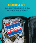 Front view of a blue 110-piece first aid kit with red latches inside an open travel suitcase