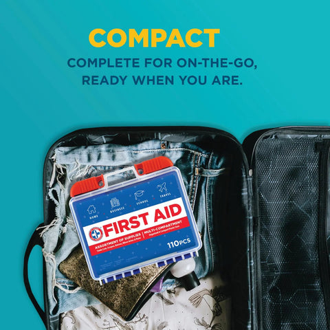 Front view of a blue 110-piece first aid kit with red latches inside an open travel suitcase