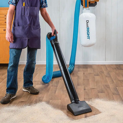 Person using 4 Inch Quick Change Floor Sweep Kit for Dust Collection with quick change handle on hardwood floor
