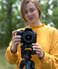 Person using a camera on a tripod with 44mm Quick Release Tripod Plate Mount Adapter for Cameras and Video Gear Universal 1 3 4 Inch Square Base
