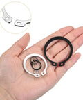 External Retaining Ring Set 150 Pcs In 15 Sizes 304 Stainless Steel Circlip Snap Rings Kit shown on a hand with varied sizes.