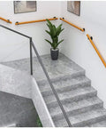 13 Foot Round Wood Stair Handrail Features Non Slip Grip For Instant Attic Stability Easy No Sweat Install Works Like A Charm On Basement Flights And Hallways For A Dope Home Upgrade with modern indoor staircase and potted plant.