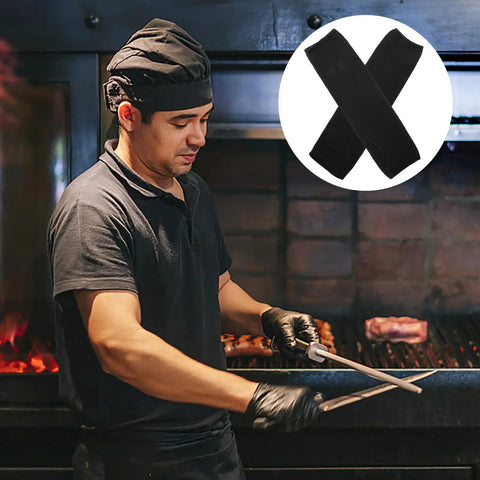 High Density Cut Resistant Arm Sleeves Two Pack Legit Tough As Nails Forearm Guards worn by chef while grilling.