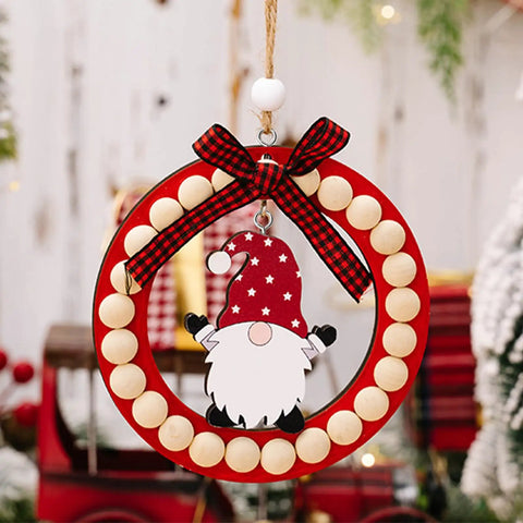Festive wreath with wooden beads, red bow, and gnome decoration hanging on a rope.