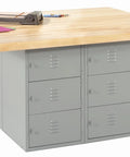 Heavy Hitter Four Station Workshop Workbench With Locker Base Setup Fresh Maple Butcher Block Top Gray Steel Frame, side view with pink papers.