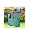 Foldable Garden Kneeler With Tool Pouch And Multiple Pockets, green tool organizer held outdoors with colorful flowers in background.