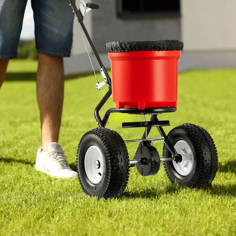 Walk Behind Broadcast Fertilizer And Seed Spreader With 90 Pound Capacity And 23 Liter Hopper, All Terrain 12.5 Inch Pneumatic Tires on lawn