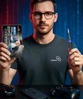 Person holding Compact 64 Piece Precision Screwdriver Set With Torx Triwing Pentalobe Bits for electronics repair, focus on packaging.