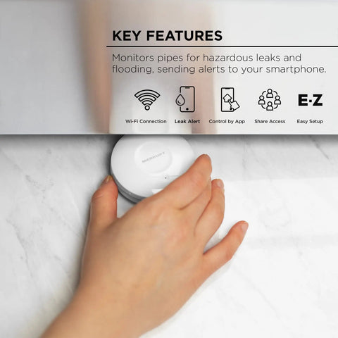 Hand placing Smart Water Leak Sensor And Alarm With 2.4 GHz Wi Fi, Flood Detection, Real Time App Notifications, No Hub Required