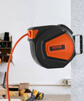 Retractable Air Hose Reel With Three Eighths Inch By Fifty Foot Hybrid Hose Up To 300 PSI For All Your Air Tools, wall-mounted in workshop.